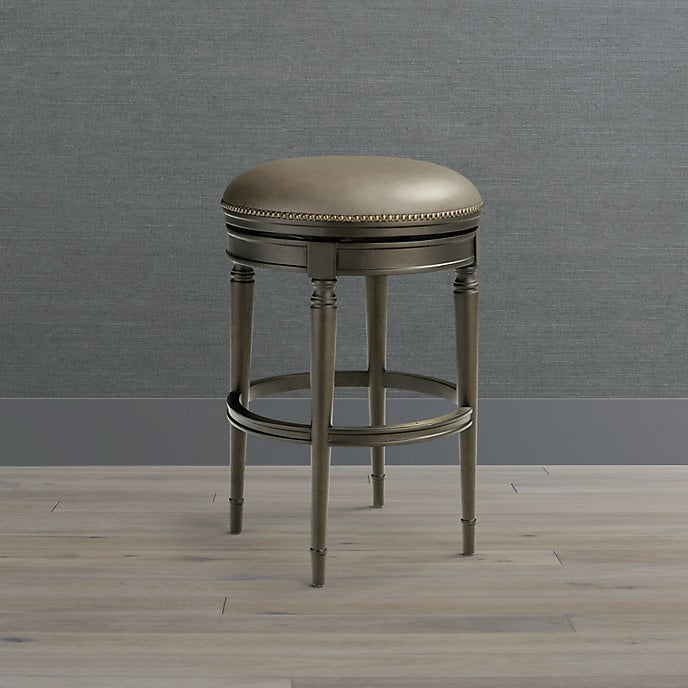 Frontgate Anderson round upholstered backless swivel stool; supplier reference photograph, finish to be confirmed