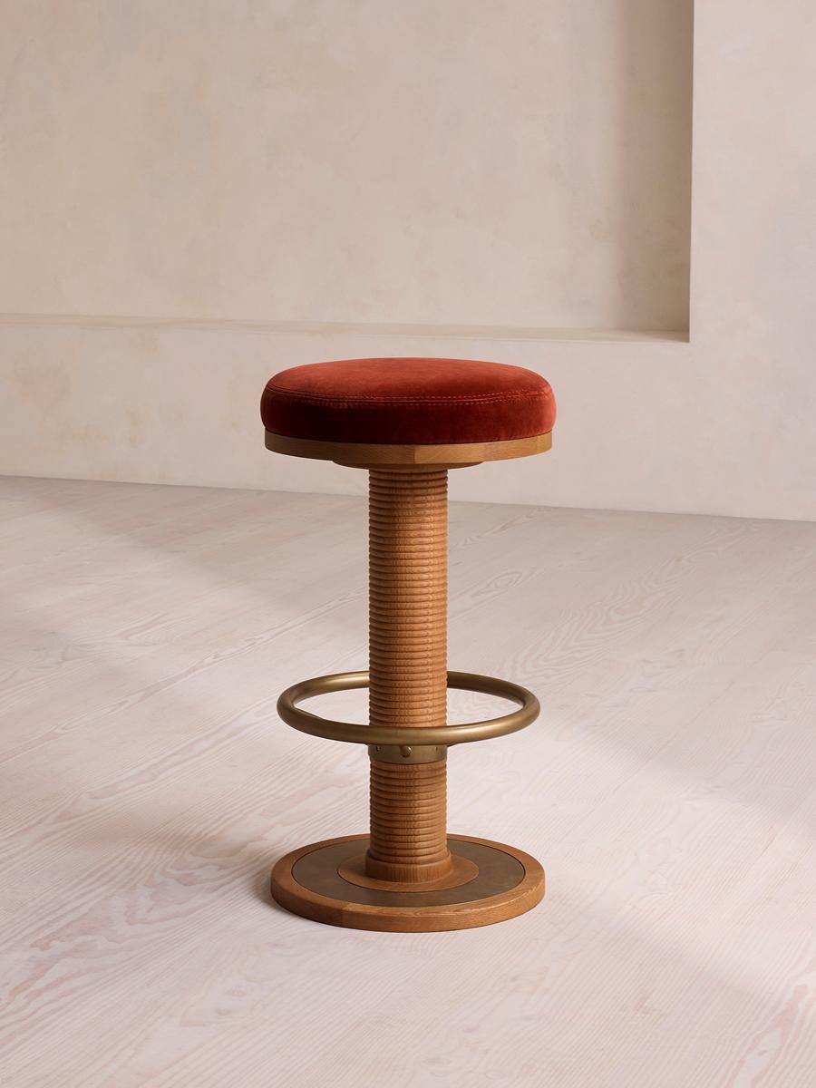 Soho Home Bryden Tall Barstool in rust velvet with grooved oak column and antique-brass footrest